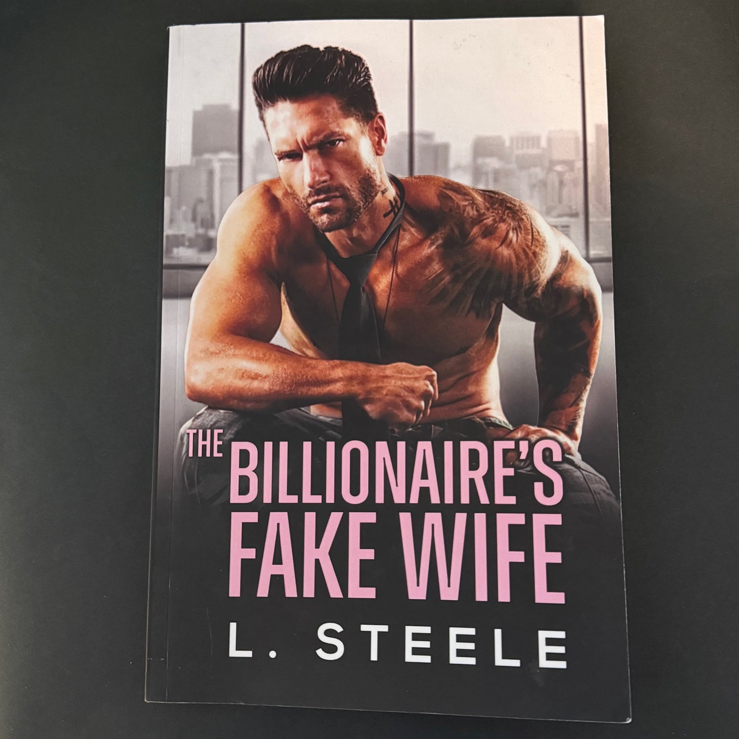 THE BILLIONAIRE'S FAKE WIFE by L. Steele